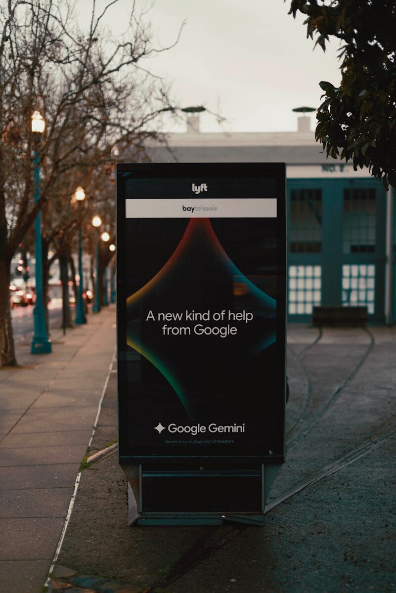Lyft and google gemini advertisement on street display.